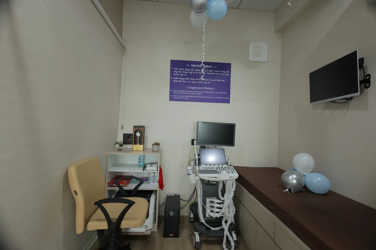 Ultrasonography scan room with USG machine and examination couch